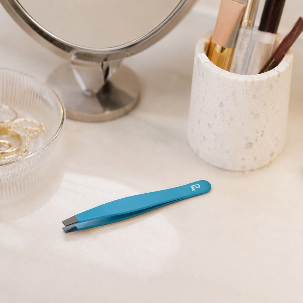 Blue slanted tip tweezers for eyebrows